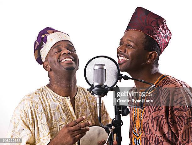 west african musicians singing and laughing - nigeria man stock pictures, royalty-free photos & images