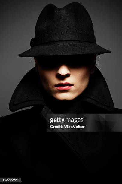 fedora - trench coat stock pictures, royalty-free photos & images