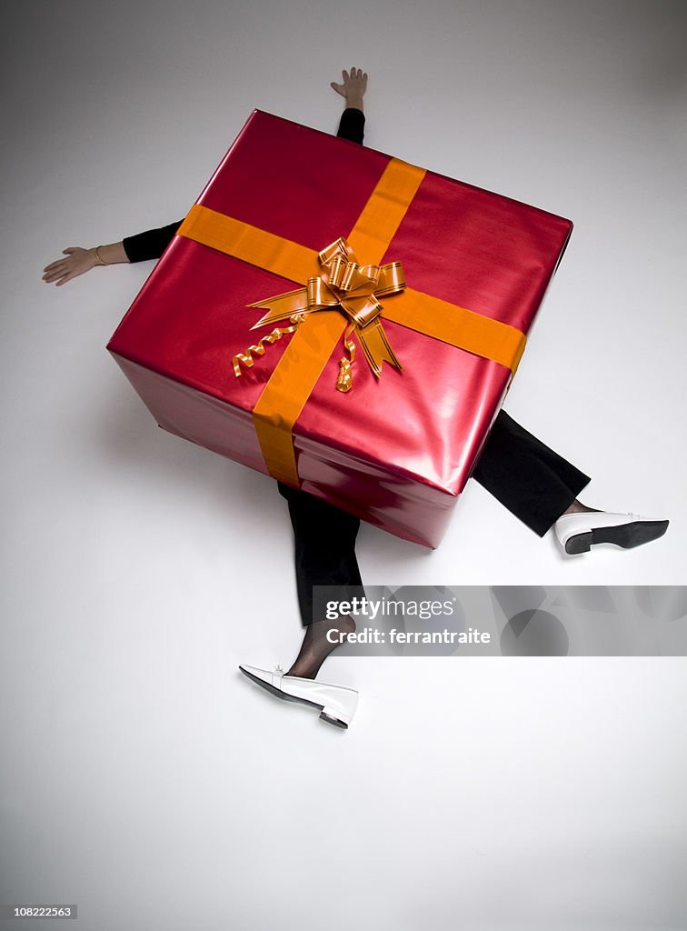 Woman Crushed Beneath Huge Wrapped Present