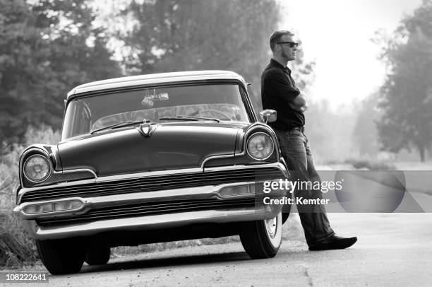 man leaning on vintage car - artists model stock pictures, royalty-free photos & images