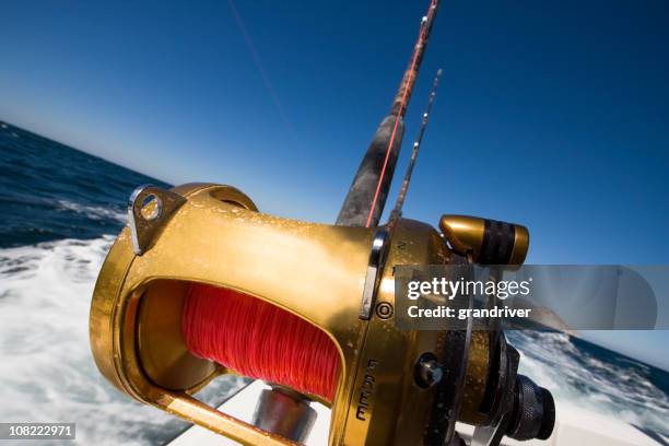 fishing reel on an ocean boat - big game fishing bildbanksfoton och bilder