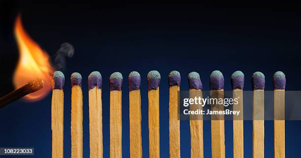 starting the fire; wooden matches in row ready to burn - domino effect stock pictures, royalty-free photos & images