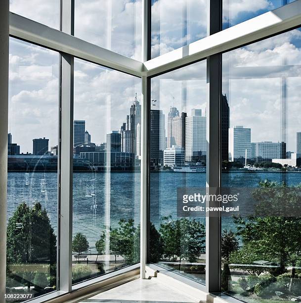 view of detroit river and skyline from inside building - detroit skyline stock pictures, royalty-free photos & images