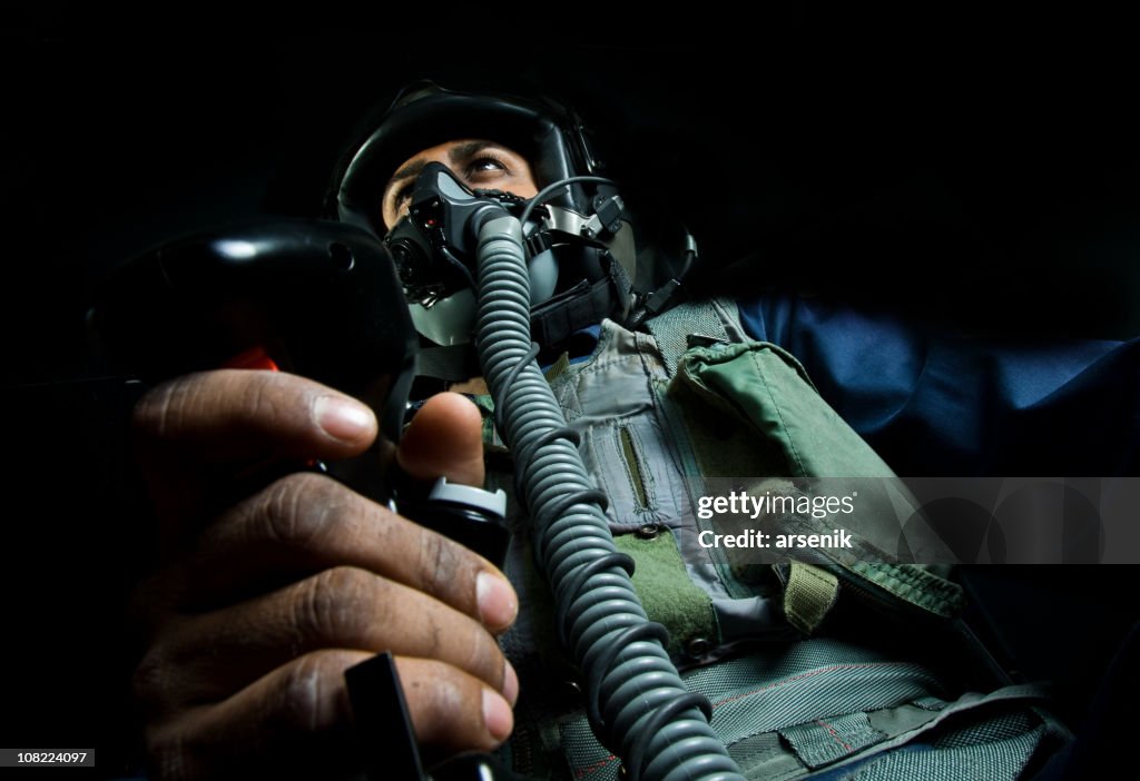 Fighter Plane Pilot Holding Throttle Wearing Helmet