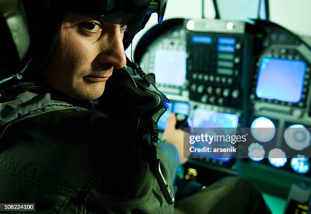 fighter plane pilot holding throttle and sitting cockpit - 空軍 個照片及圖片檔