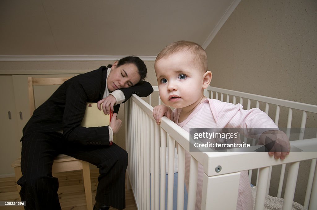 Mother Asleep on Crib with Baby Awake and Watching