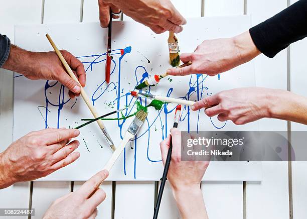 painting together - kunst stockfoto's en -beelden