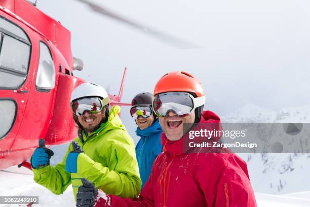 small group heli skiing - heli skiing stock pictures, royalty-free photos & images