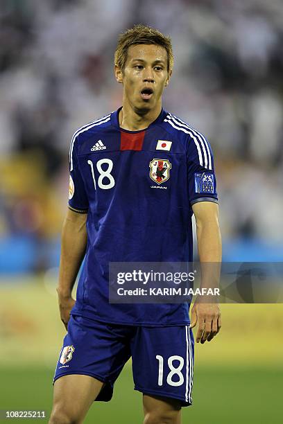 Japan's midfielder Keisuke Honda stands on the pitch during the 2011 Asian Cup quarter-final football match between Japan and Qatar at Al-Gharafa...