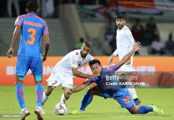 Bahrain's midfielder Abdulwahab Al Safi fights for the ball with India's forward Jeje Lalpekhlua during the 2019 AFC Asian Cup group A football match...