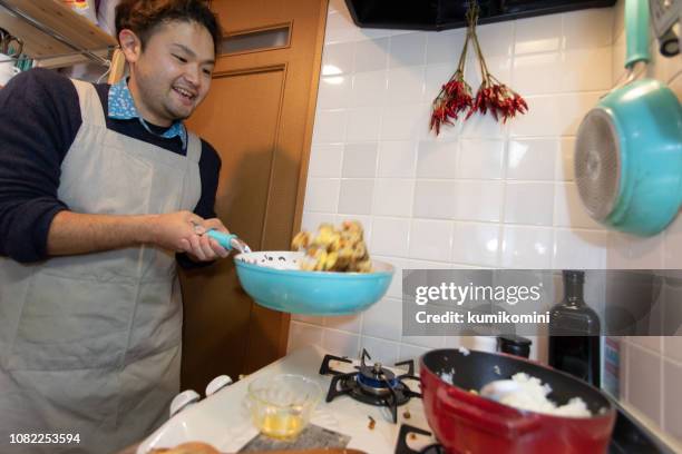 Man Cooking Rice Photos and Premium High Res Pictures - Getty Images