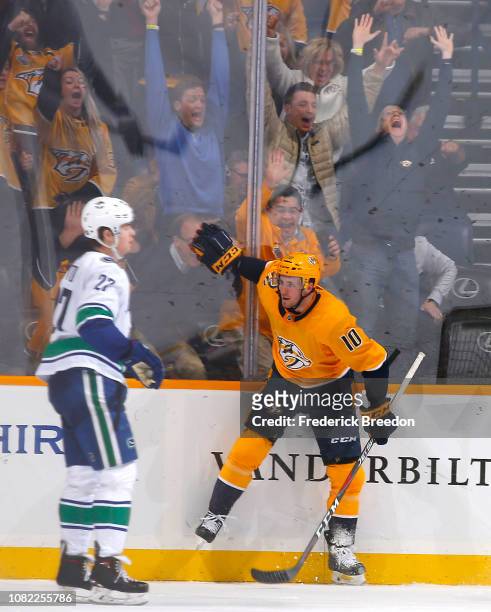 Fans cheer as Colton Sissons of the Nashville Predators celebrates scoring the game winning overtime goal against the Vancouver Canucks during the...