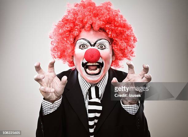 businessman clown growling - evil clown stock pictures, royalty-free photos & images