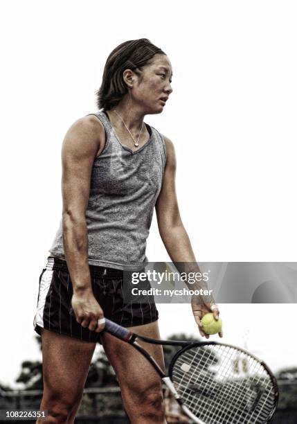 preparing to serve tennis ball - tennis player stock pictures, royalty-free photos & images