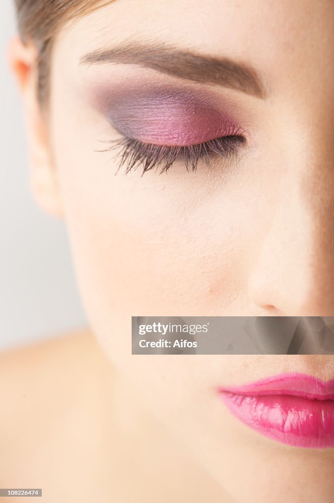 Half of Woman's Face with Closed Eye Wearing Make-up