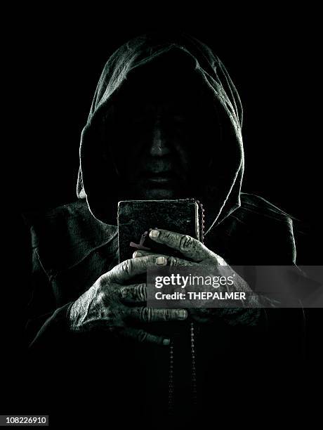 sinister monk - hood clothing stock pictures, royalty-free photos & images