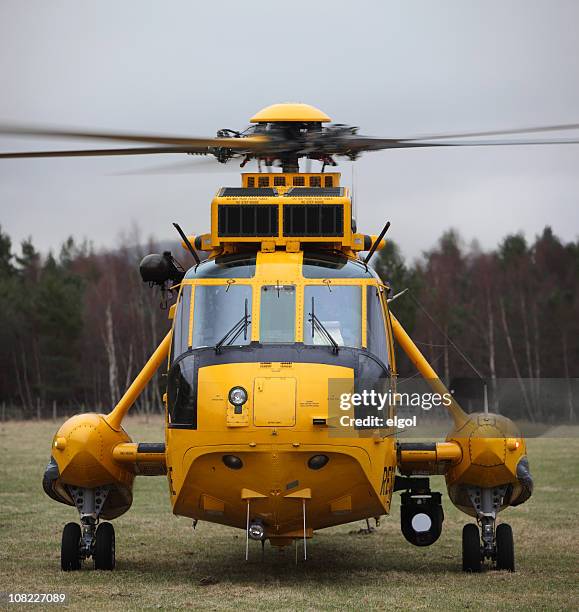 transport rescue helicopter in field with forest - rescuers stock pictures, royalty-free photos & images