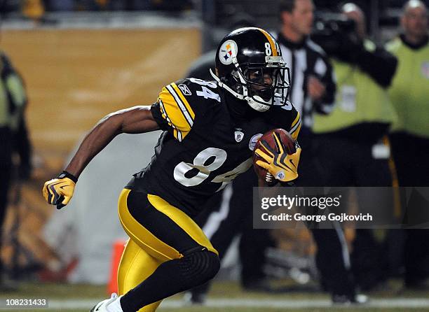 Kick returner Antonio Brown of the Pittsburgh Steelers runs with the football against the Baltimore Ravens during an AFC Divisional Playoff Game at...