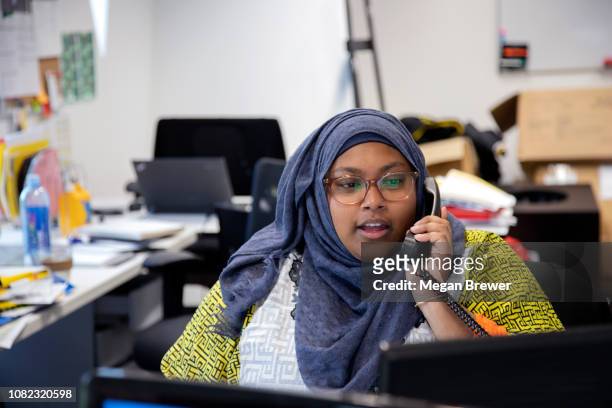 Woman talking on office phone