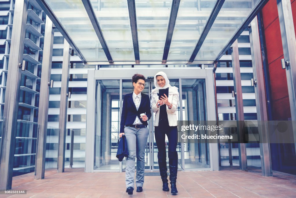 Businesswomen quitting the office building