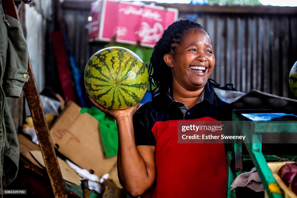 Woman laughing at her place of business