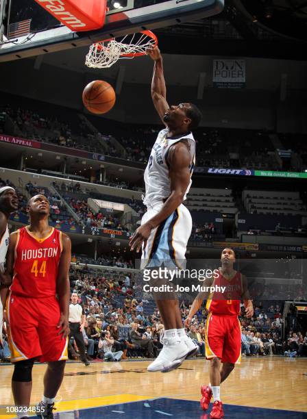 Tony Allen of the Memphis Grizzlies dunks against Chuck Hayes of the Houston Rockets on January 21, 2011 at FedExForum in Memphis, Tennessee. NOTE TO...