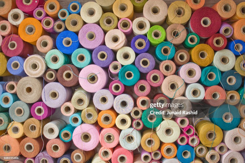 Colorful stack of Pakistan's Cotton Thread Reels