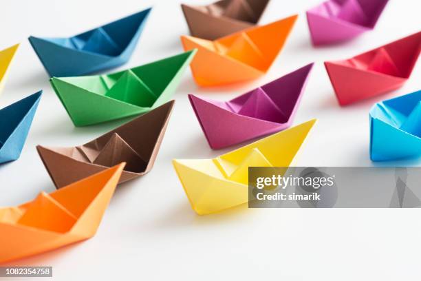 paper boats - origami boat stock pictures, royalty-free photos & images