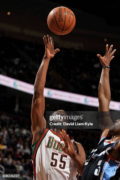 Keyon Dooling of the Milwaukee Bucks shoots against Ramon Sessions of the Cleveland Cavaliers during the game at The Quicken Loans Arena on January...