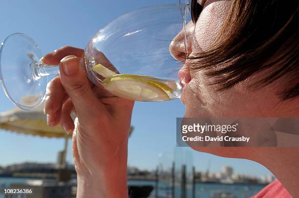 woman drinking white wine - algarve wine stock pictures, royalty-free photos & images