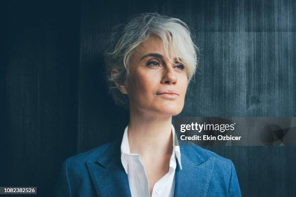 ageless woman in contemplative mood - beautiful woman gray hair stock pictures, royalty-free photos & images