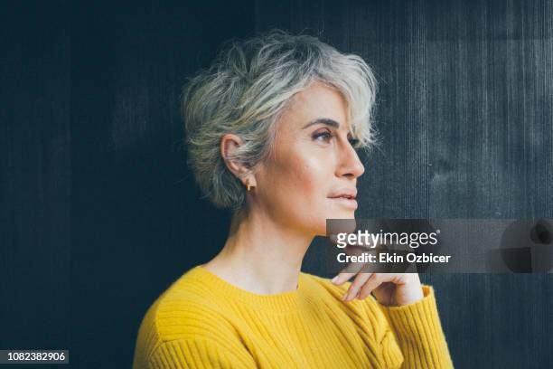 ageless woman in contemplative mood - showus portrait stock pictures, royalty-free photos & images