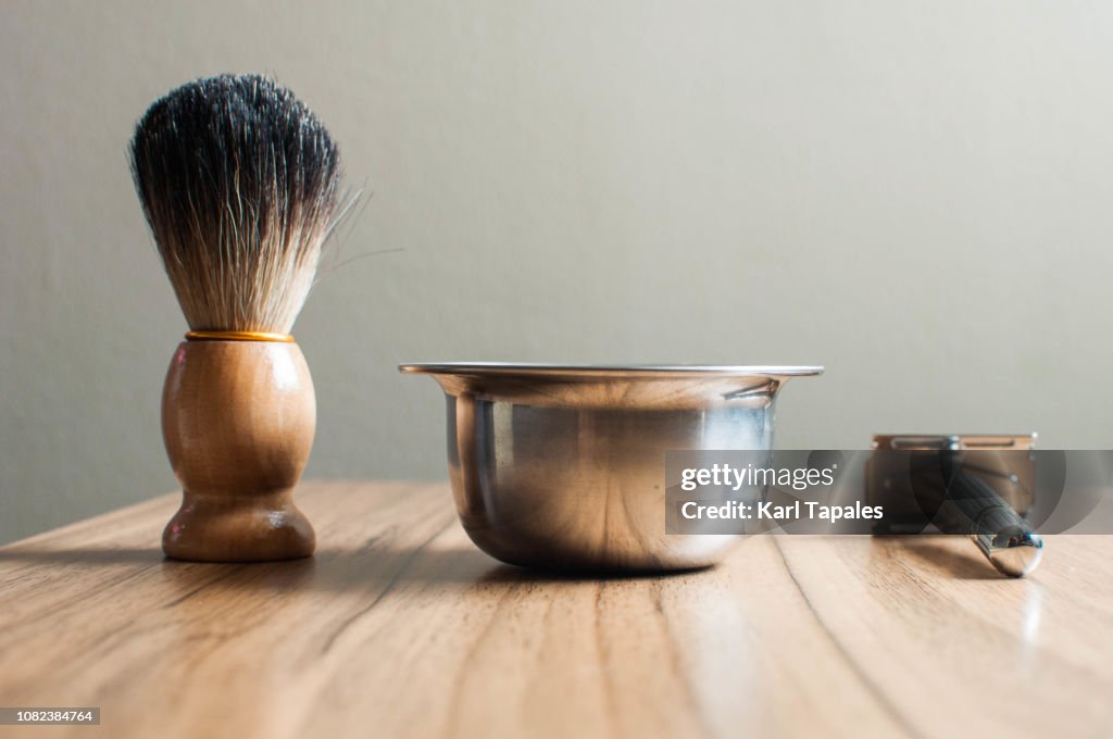 Shaving accessories on a wooden table