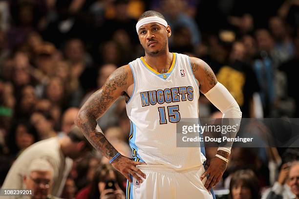 Carmelo Anthony of the Denver Nuggets looks on during a break in the action against the Los Angeles Lakers at the Pepsi Center on January 21, 2011 in...