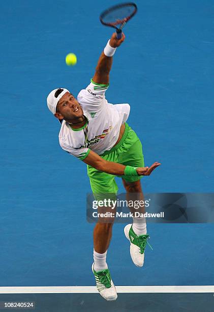 Jurgen Melzer of Austria serves in his third round match against Marcos Baghdatis of Cyprus during day six of the 2011 Australian Open at Melbourne...