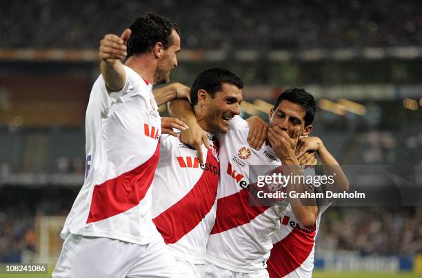 John Aloisi and Simon Colosimo of the Heart celebrate Aloisi's goal with fellow teammates during the round 24 A-League match between the Melbourne...