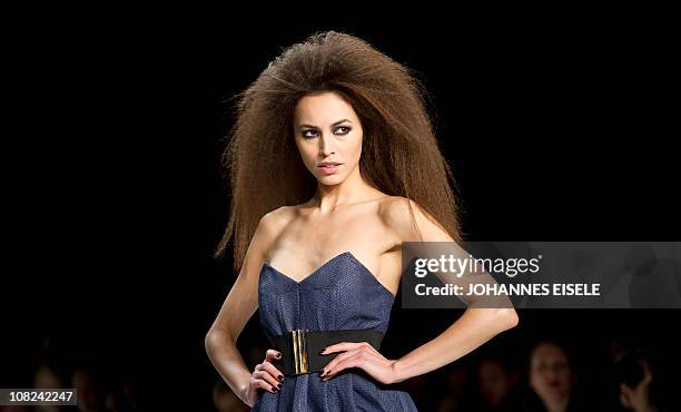 Model presents fashion of designer label Marcel Ostertag during the Berlin fashion week in Berlin on January 22, 2011. The Berlin Fashion Week is...