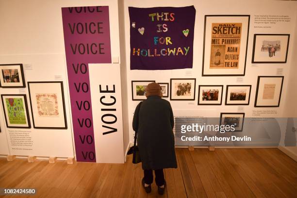 Woman views a Suffragette exhibition on display in the People's History Museum ahead of the unveiling of a statue of the suffragette Emmeline...