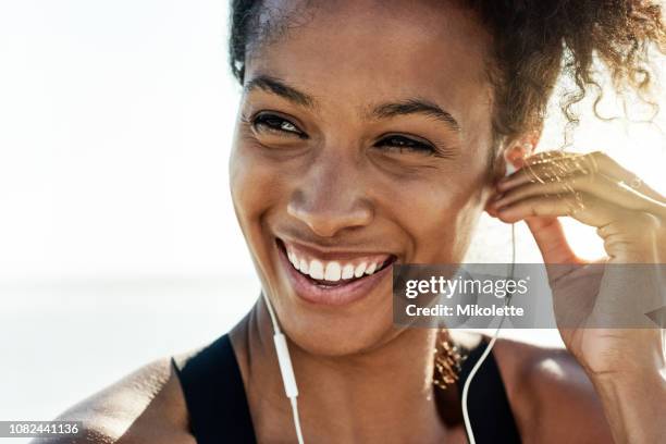 the healthier i am the happier i feel - young woman beach smiling stock pictures, royalty-free photos & images