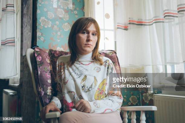 Trans woman sitting on a rocking chair