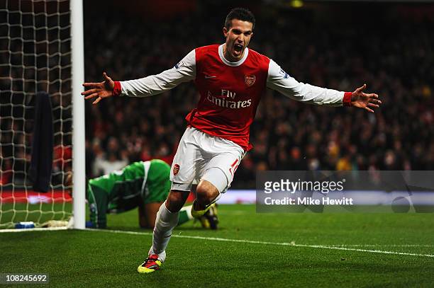 Robin Van Persie of Arsenal celebrates scoring his third goal in a hat trick during the Barclays Premier League match between Arsenal and Wigan...