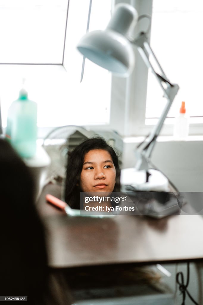Reflection of a young Filipino woman