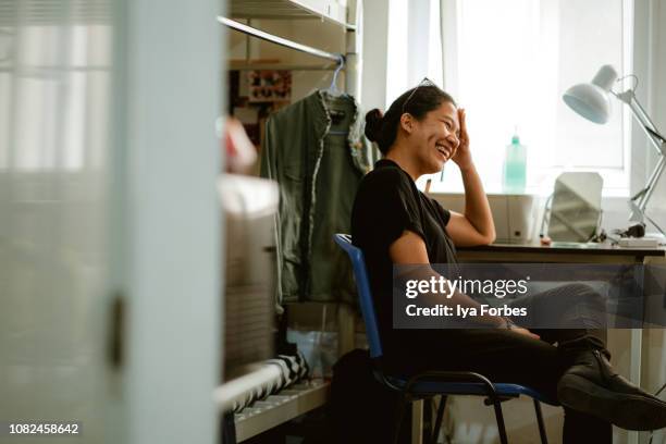 young filipino student sitting in her dorm room - polytechnic university of the philippines manila stock pictures, royalty-free photos & images