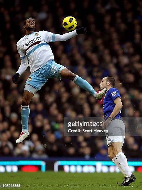 Frederic Piquionne of West Ham in action with John Heitinga of Everton during the Barclays Premier League match at Goodison Park on January 22, 2011...