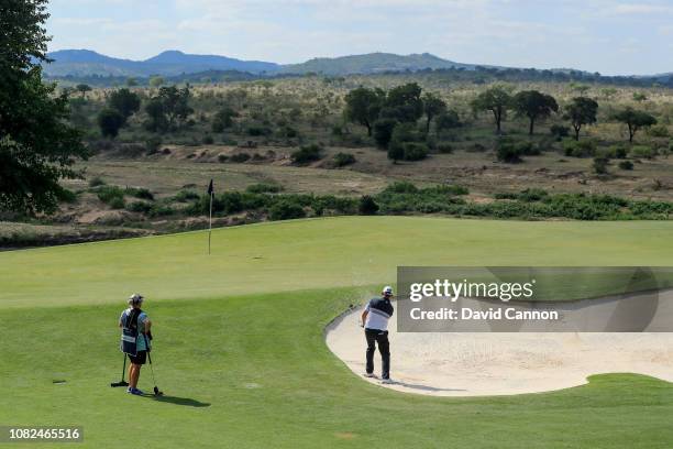 David Drysdale of Scotland plays his third shot on the par 5, 13th hole with the Kruger National Park behind the green during the second round of the...