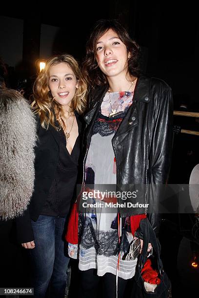 Alysson Paradis and Tamara Kaboutchek attend the John Galliano: Paris Fashion Week Menswear F/W 2011 show as part of Paris Menswear Fashion Week...
