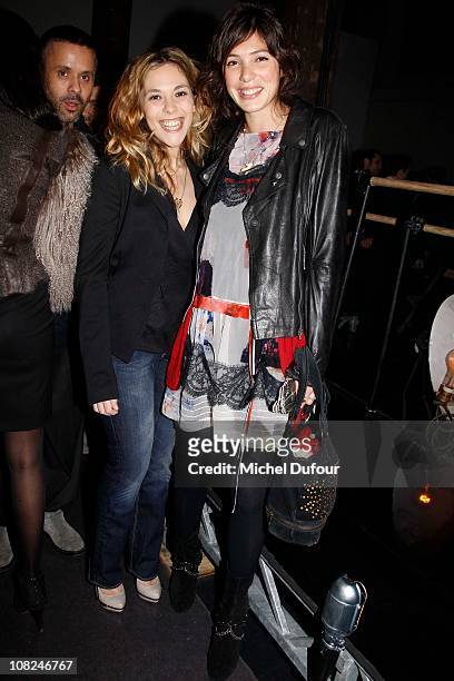 Alysson Paradis and Tamara Kaboutchek attend the John Galliano: Paris Fashion Week Menswear F/W 2011 show as part of Paris Menswear Fashion Week...