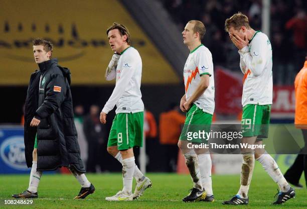Marko Marin, Clemens Fritz, Petri Pasanen, Per Mertesacker of Bremen look dejected after loosing the Bundesliga match between 1.FC Koeln and SV...