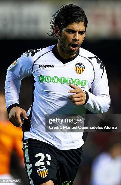 Ever Banega of Valencia celebrates after scoring during the La Liga match between Valencia and Malaga at Estadio Mestalla on January 22, 2011 in...
