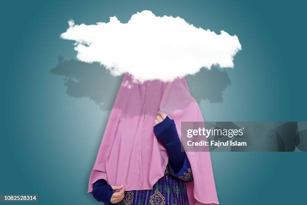 shyness of muslim woman - hoofddoek stockfoto's en -beelden